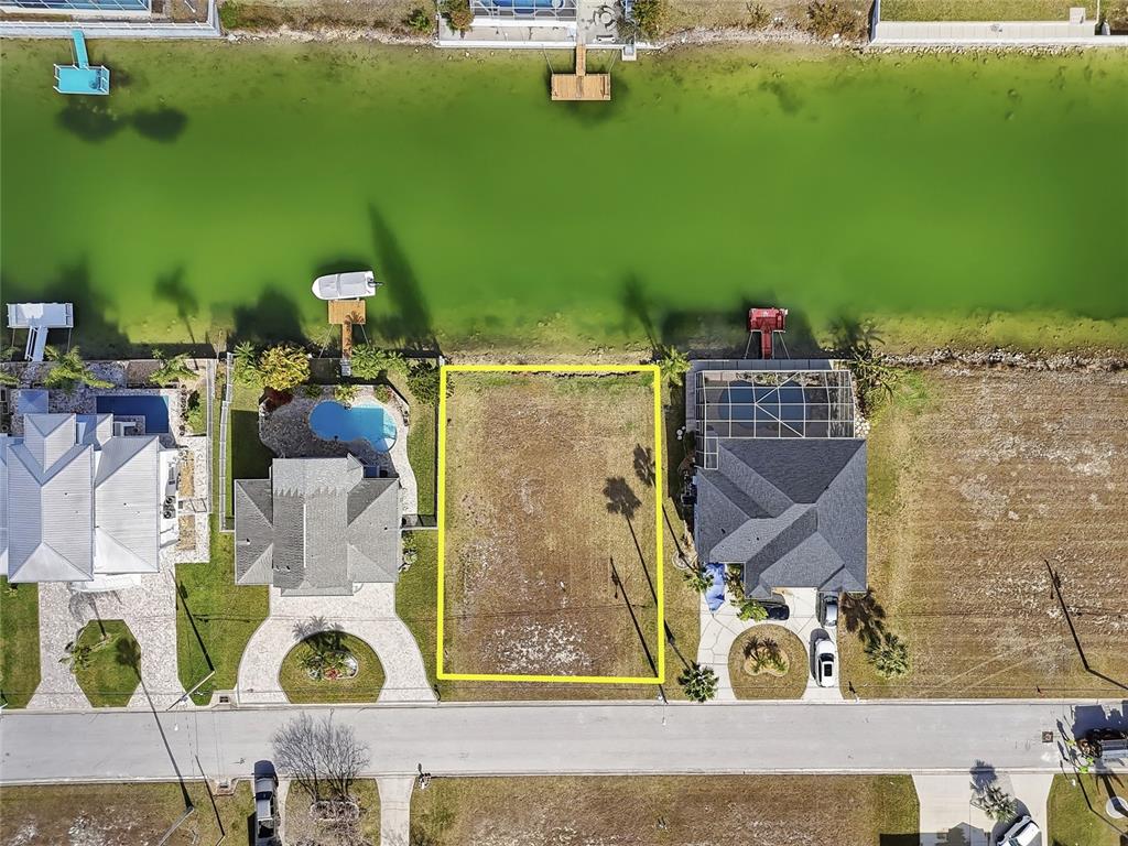 Undisclosed Address Hernando Beach, FL 34607 - Photo 7 of 14 an aerial view of a house with a swimming pool