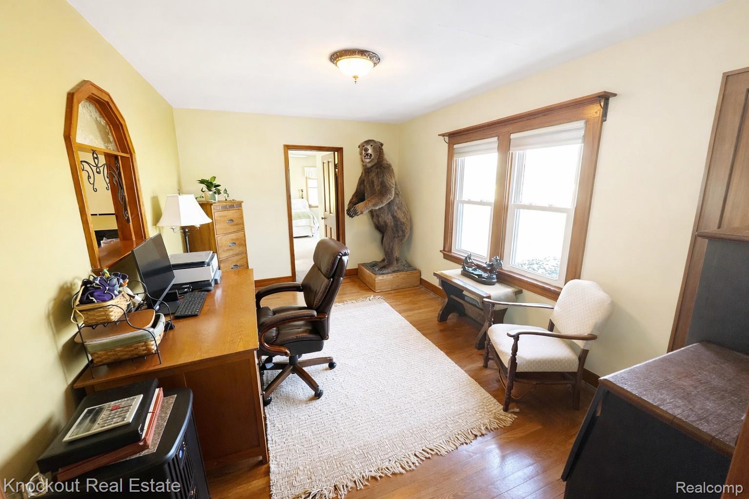 8980 Curtis Road Frankenmuth, MI 48734 - Photo 16 of 56 Home office featuring dark wood-style floors and baseboards