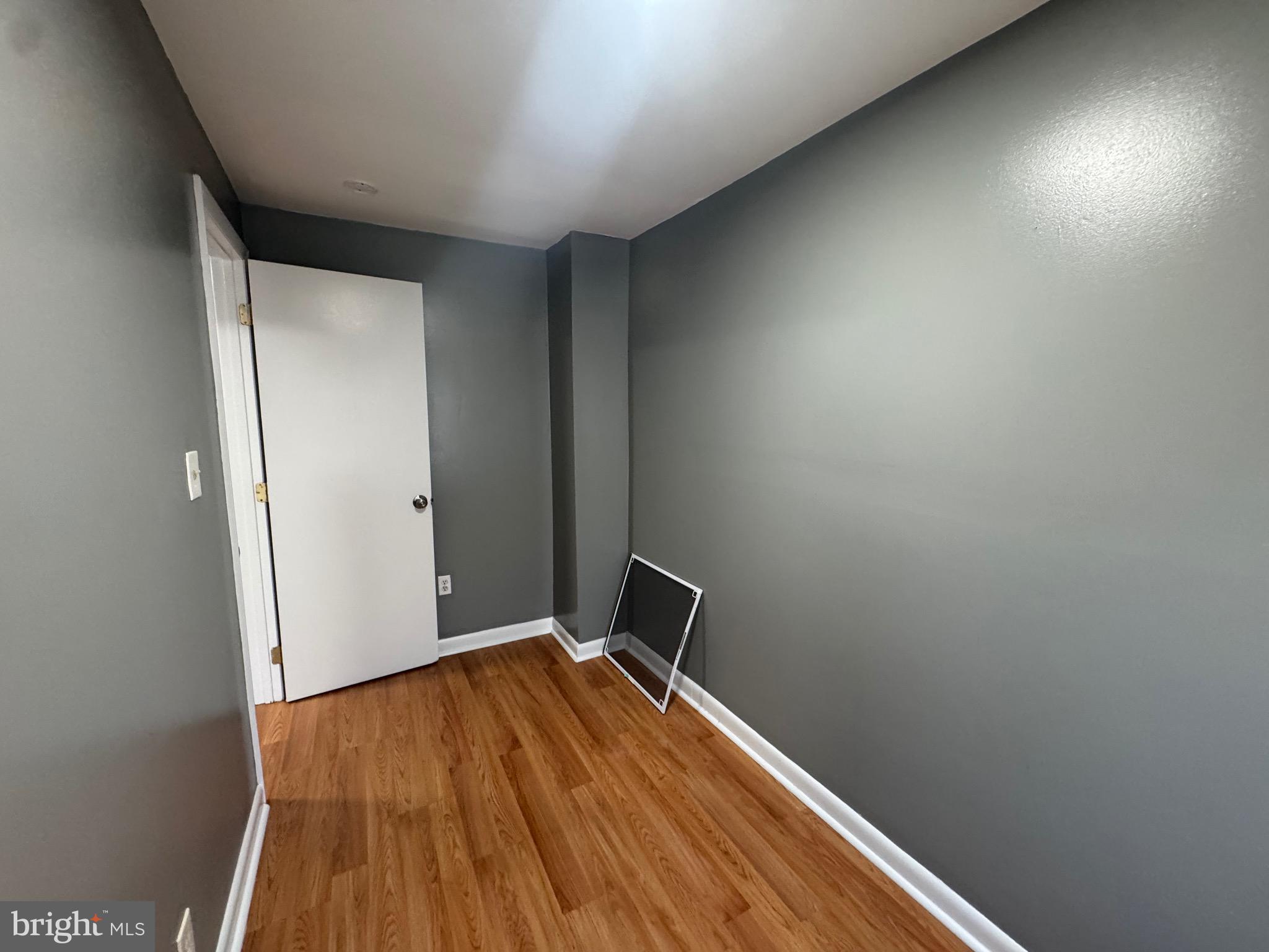 2408 Wilkens Avenue Baltimore, MD 21223 - Photo 13 of 26 a view of a room with wooden floor