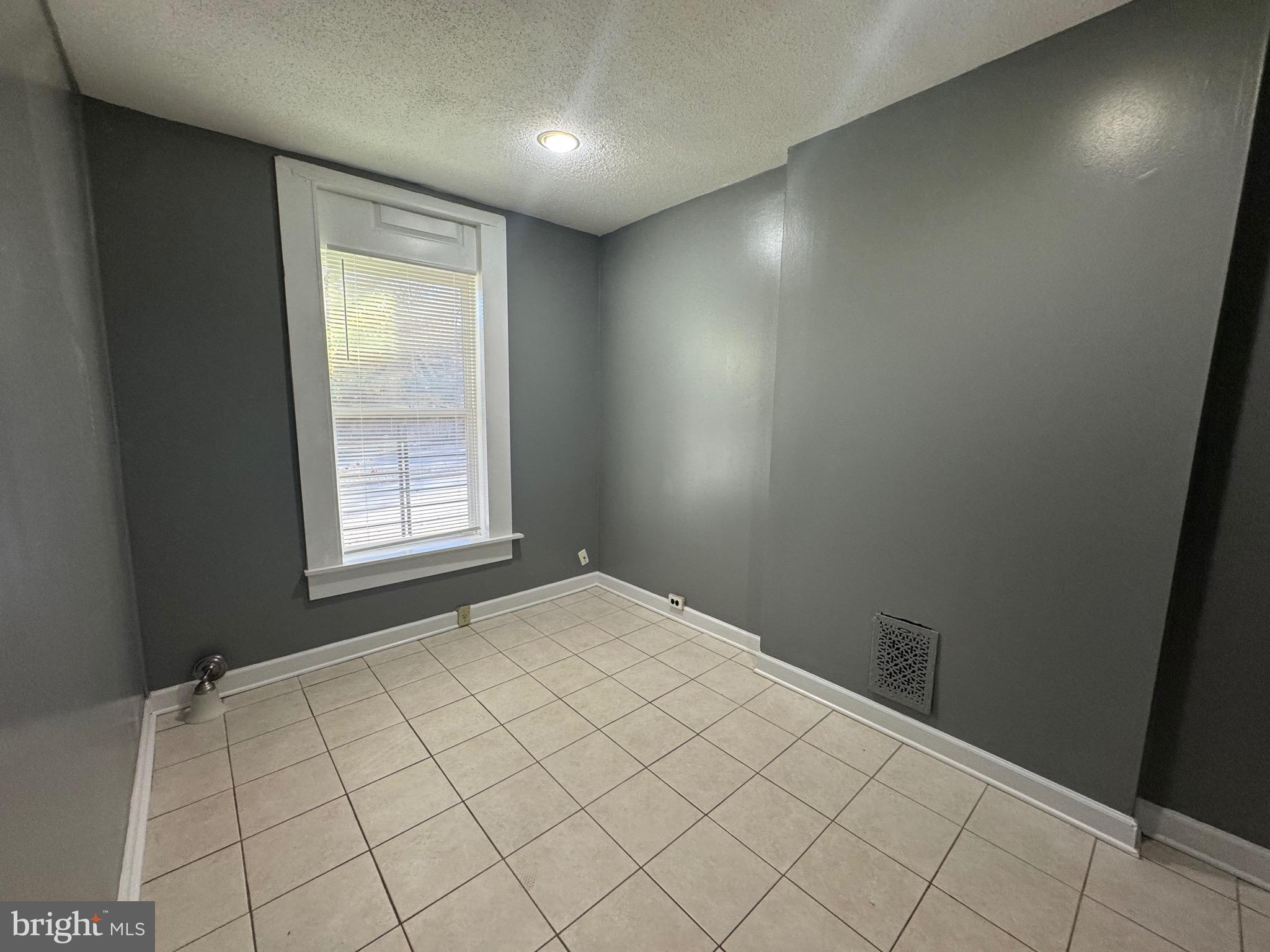 2408 Wilkens Avenue Baltimore, MD 21223 - Photo 16 of 26 an empty room with windows