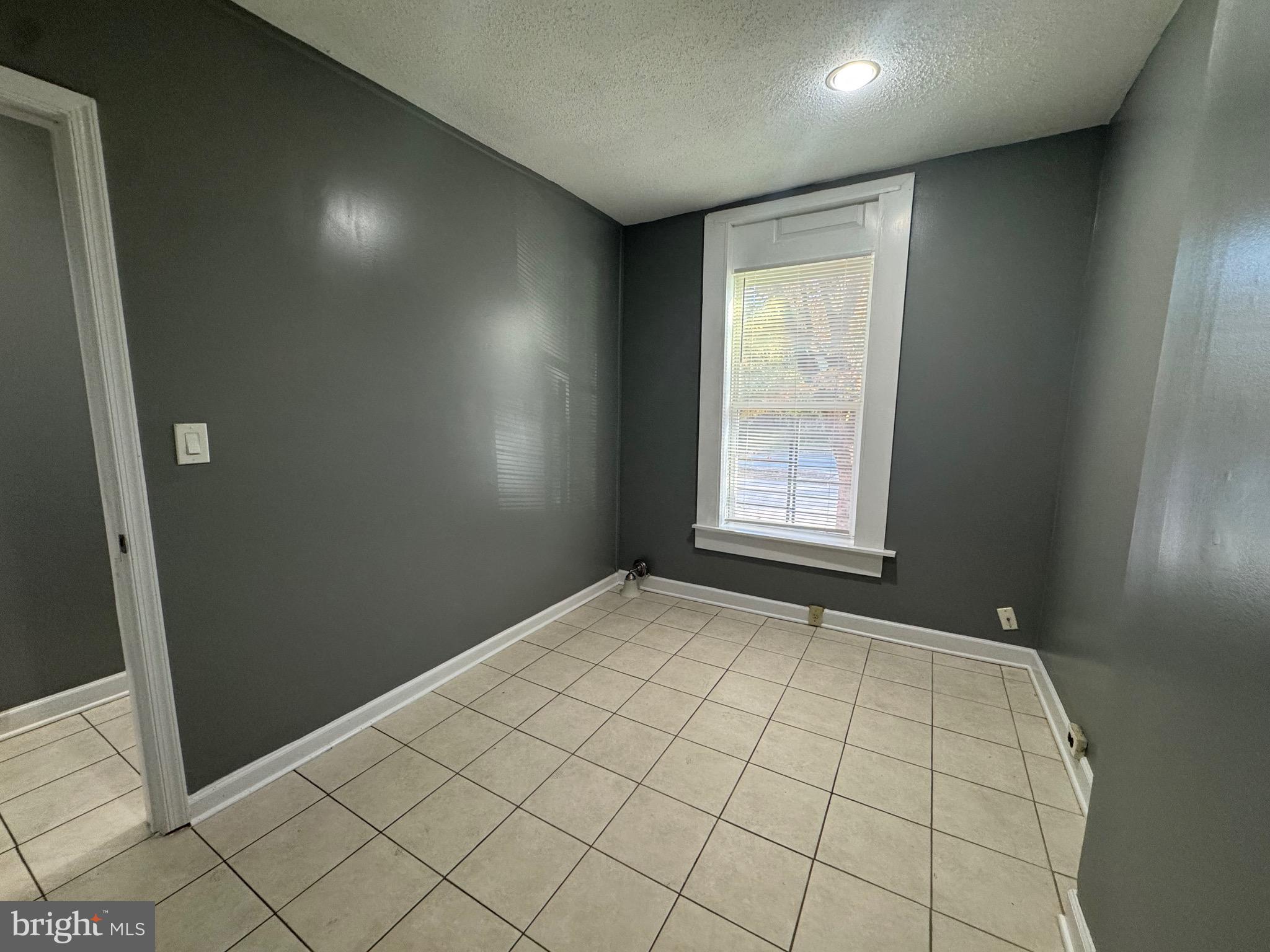 2408 Wilkens Avenue Baltimore, MD 21223 - Photo 17 of 26 a view of an empty room and window