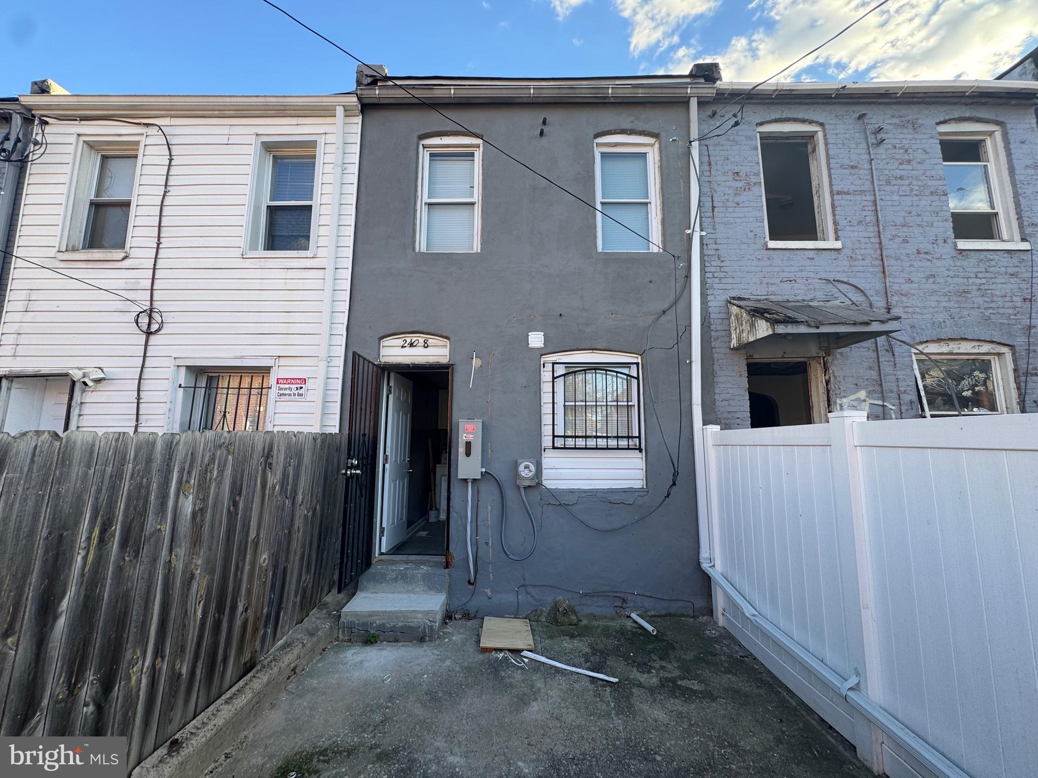 2408 Wilkens Avenue Baltimore, MD 21223 - Photo 23 of 26 a view of a house with wooden fence