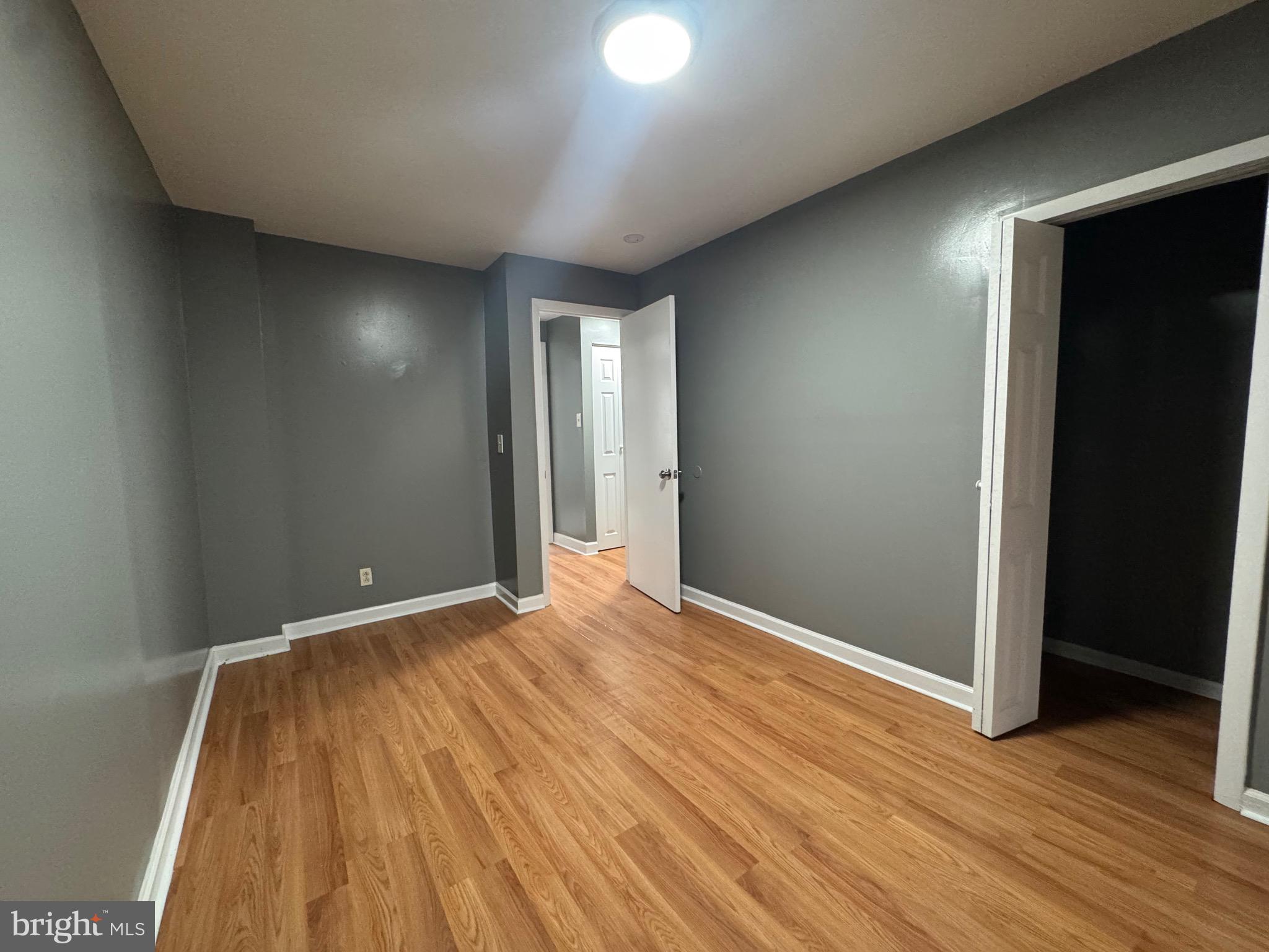 2408 Wilkens Avenue Baltimore, MD 21223 - Photo 9 of 26 a view of empty room with wooden floor