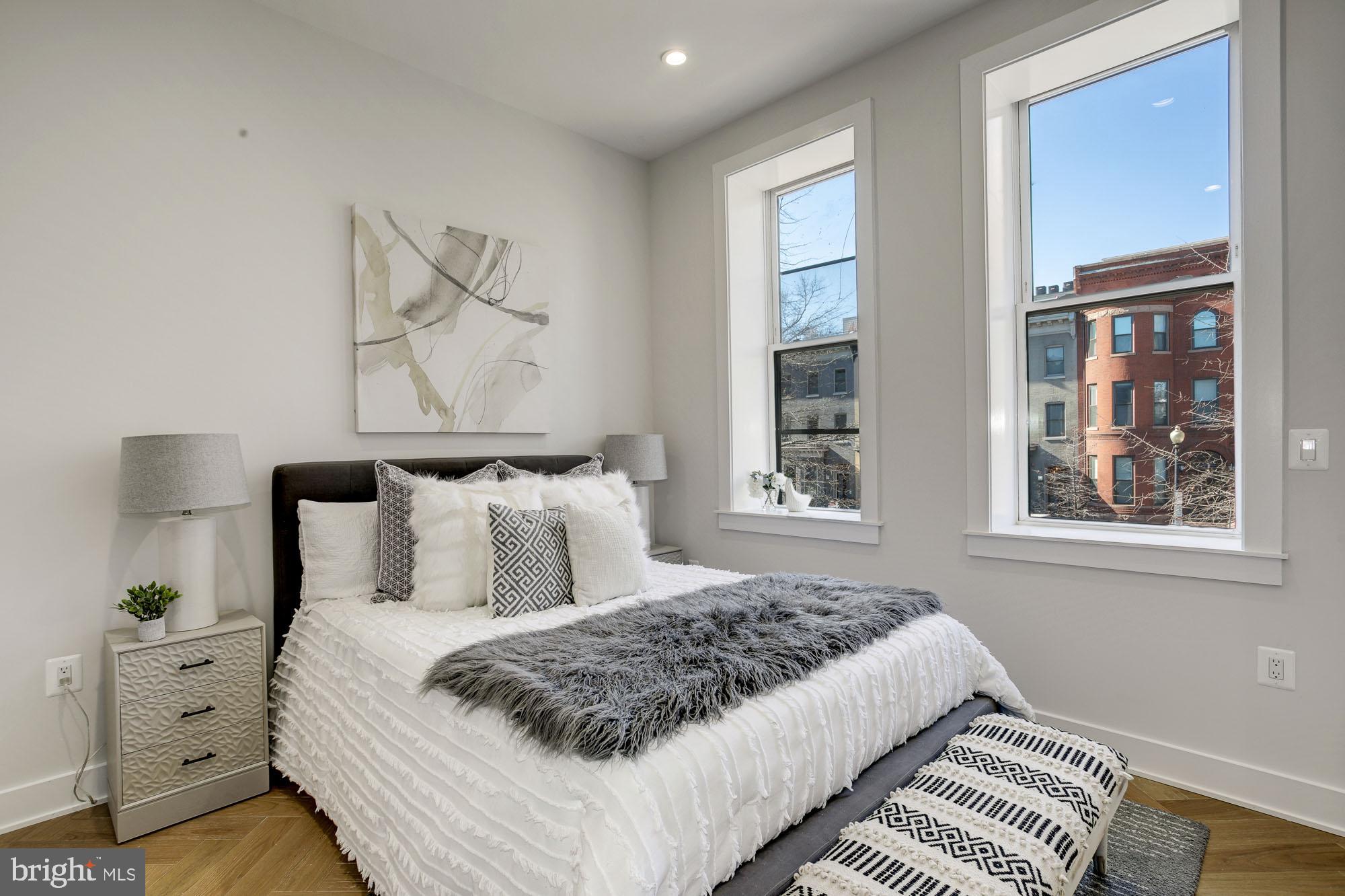 1225 11th Street Northwest, Unit 6 Washington, DC 20001 - Photo 5 of 15 a bedroom with a bed and wooden floor