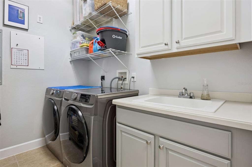 1400 Celebration Avenue, Unit 401 Celebration, FL 34747 - Photo 26 of 68 a utility room with dryer and washer