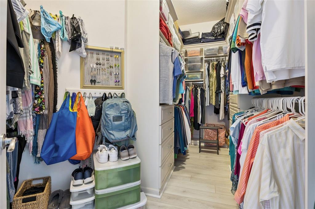 1400 Celebration Avenue, Unit 401 Celebration, FL 34747 - Photo 33 of 68 a view of walk in closet with clothes and shoes