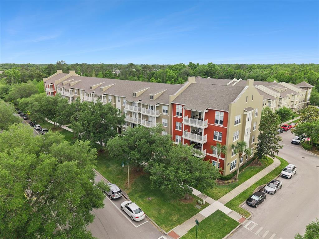 1400 Celebration Avenue, Unit 401 Celebration, FL 34747 - Photo 40 of 68 an aerial view of residential houses with outdoor space and trees