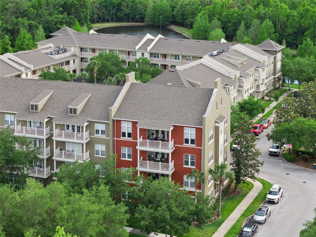 1400 Celebration Avenue, Unit 401 Celebration, FL 34747 - Photo 4 of 68 an aerial view of multiple houses with a yard