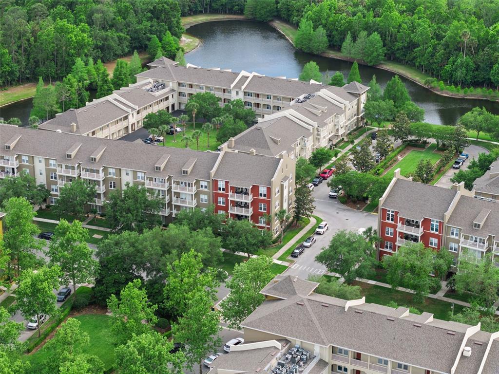 1400 Celebration Avenue, Unit 401 Celebration, FL 34747 - Photo 41 of 68 an aerial view of a house with yard and green space