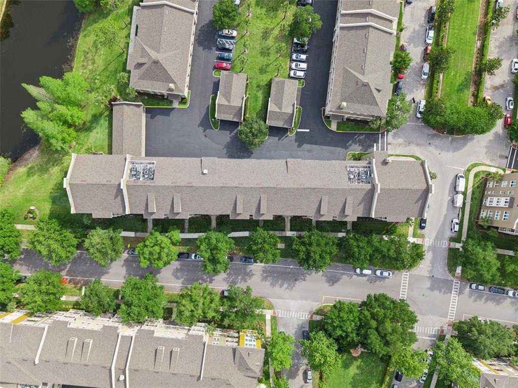 1400 Celebration Avenue, Unit 401 Celebration, FL 34747 - Photo 43 of 68 an aerial view of a house with garden space and street view