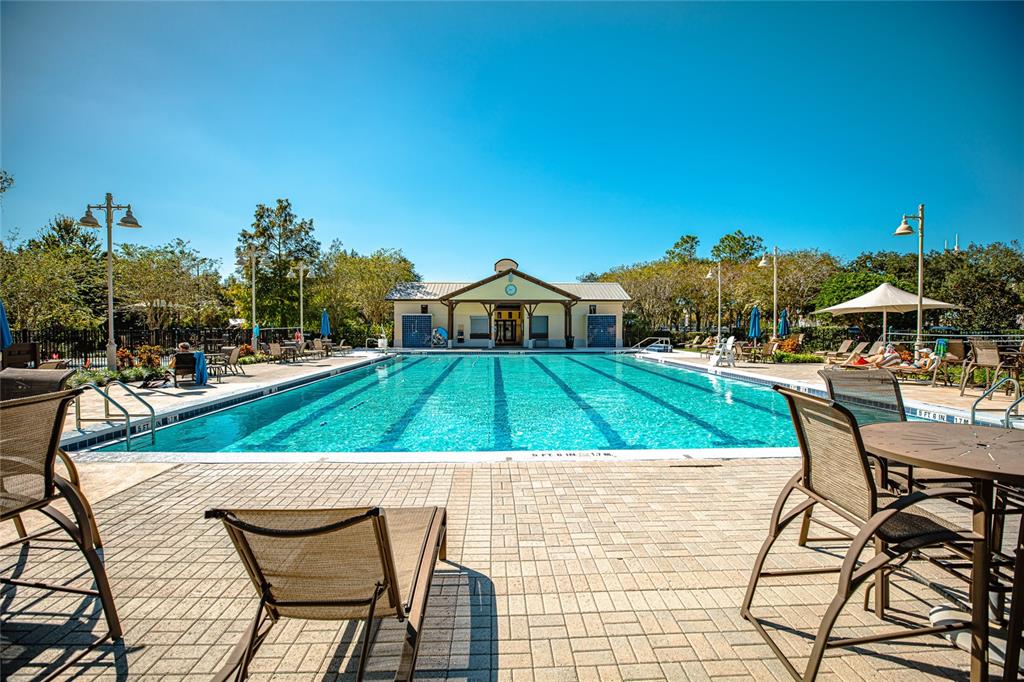 1400 Celebration Avenue, Unit 401 Celebration, FL 34747 - Photo 52 of 68 swimming view with lawn chairs