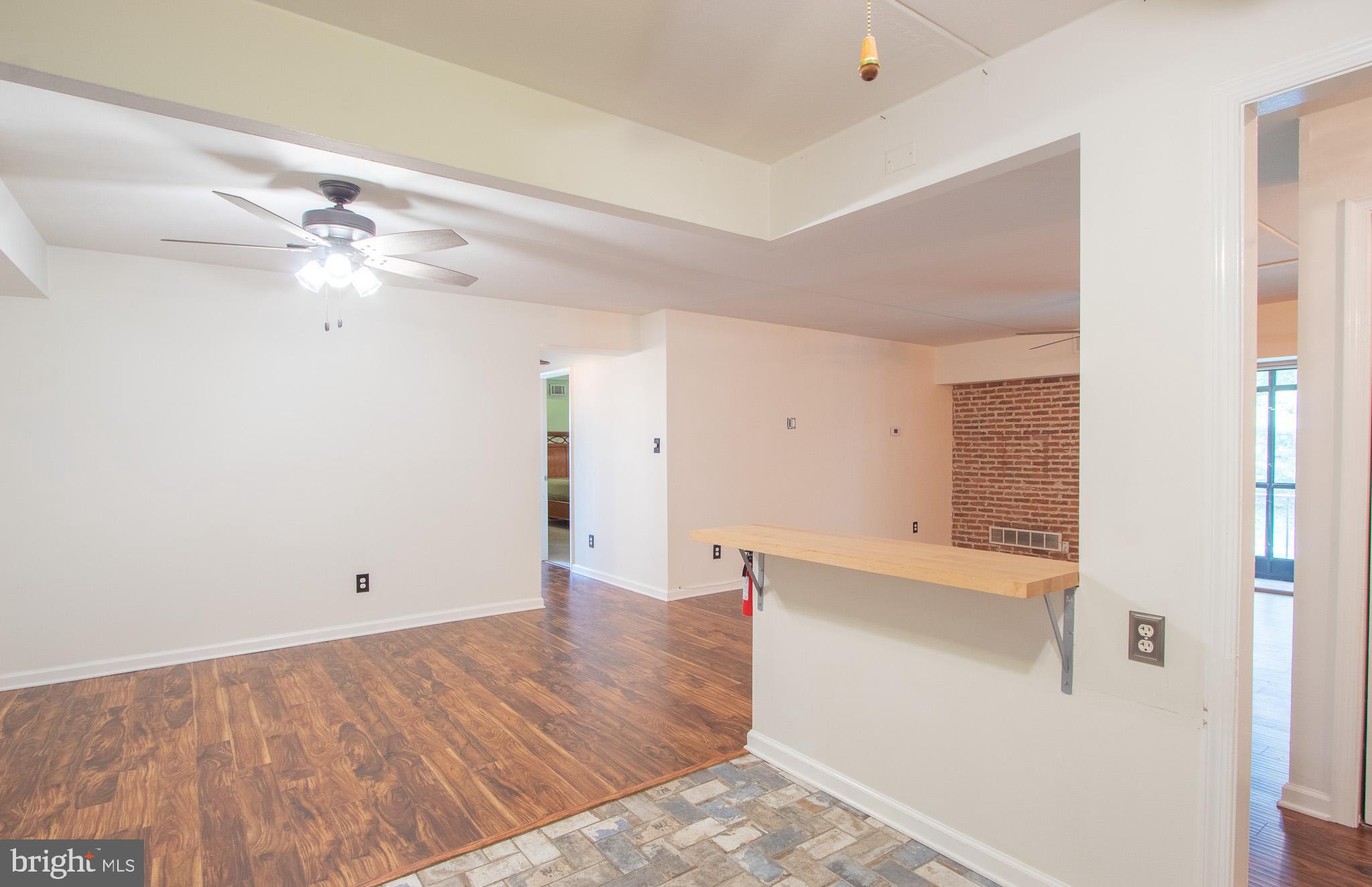 76 Welsh Tract Road, Unit F109 Newark, DE 19713 - Photo 12 of 31 wooden floor in an empty room