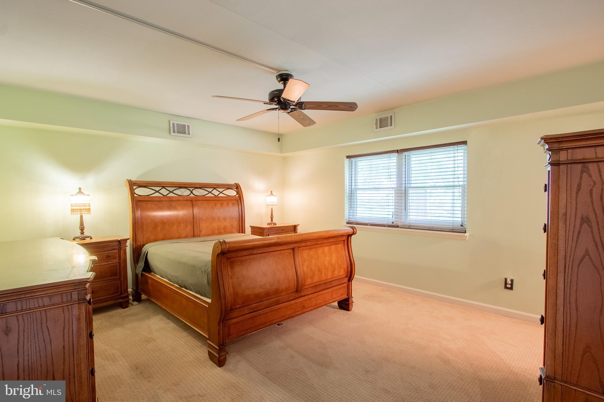 76 Welsh Tract Road, Unit F109 Newark, DE 19713 - Photo 21 of 31 a bedroom with a bed and window