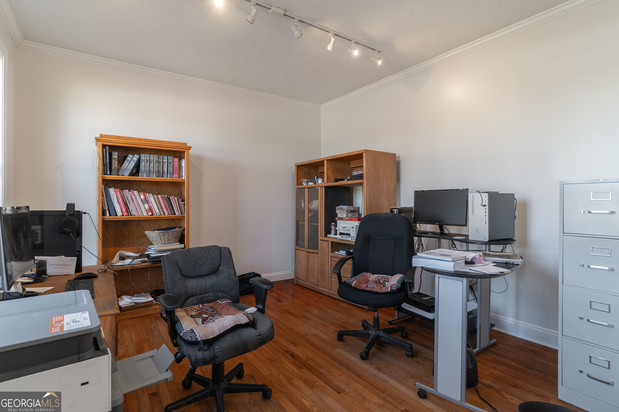724 Teamon Road Griffin, GA 30223 - Photo 25 of 50 a view of a workspace with furniture and a window