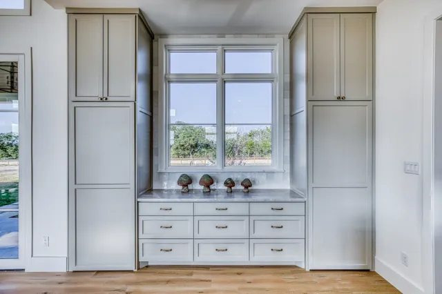 a kitchen with granite countertop a stove and a sink