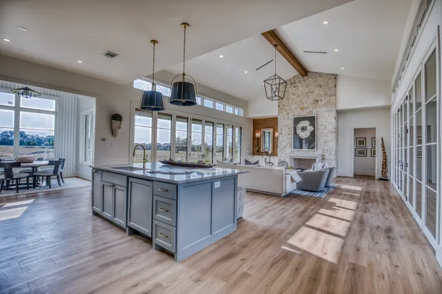 a view of white cabinets and wooden floor
