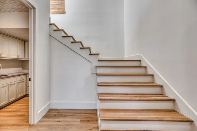 a kitchen with a sink and cabinets