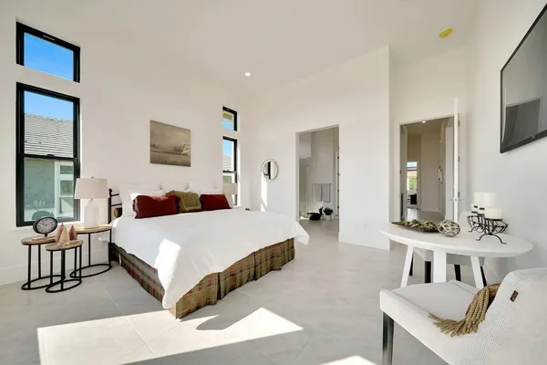 a spacious bathroom with a granite countertop sink a toilet and a mirror