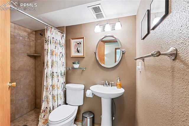 7510 Julynn Road Colorado Springs, CO 80919 - Photo 30 of 36 Basement bathroom features a walk-in shower