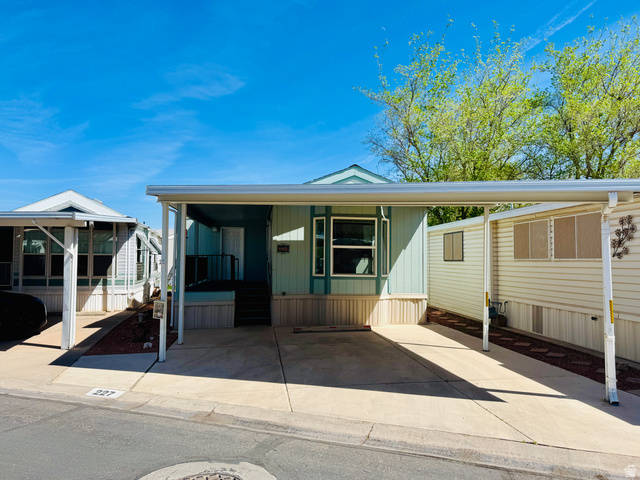 Undisclosed Address Washington, UT 84780 - Photo 1 of 1 Manufactured / mobile home featuring an attached carport