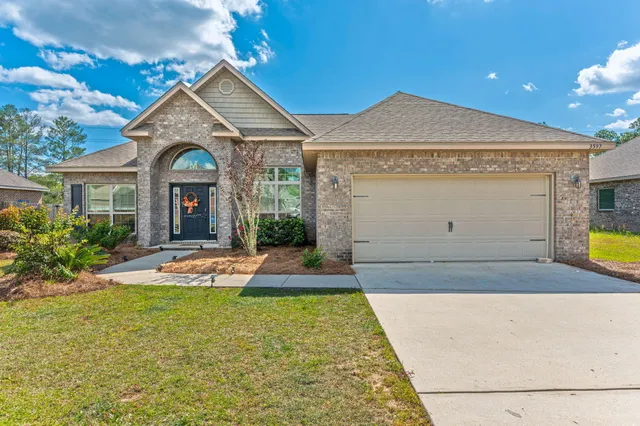 a view of a house with swimming pool and sitting area