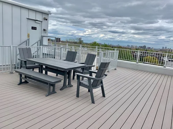 a view of a terrace with wooden floor and outdoor seating