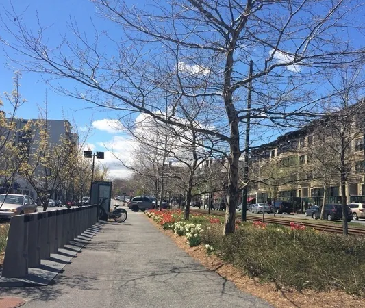 a city street lined with buildings and cars