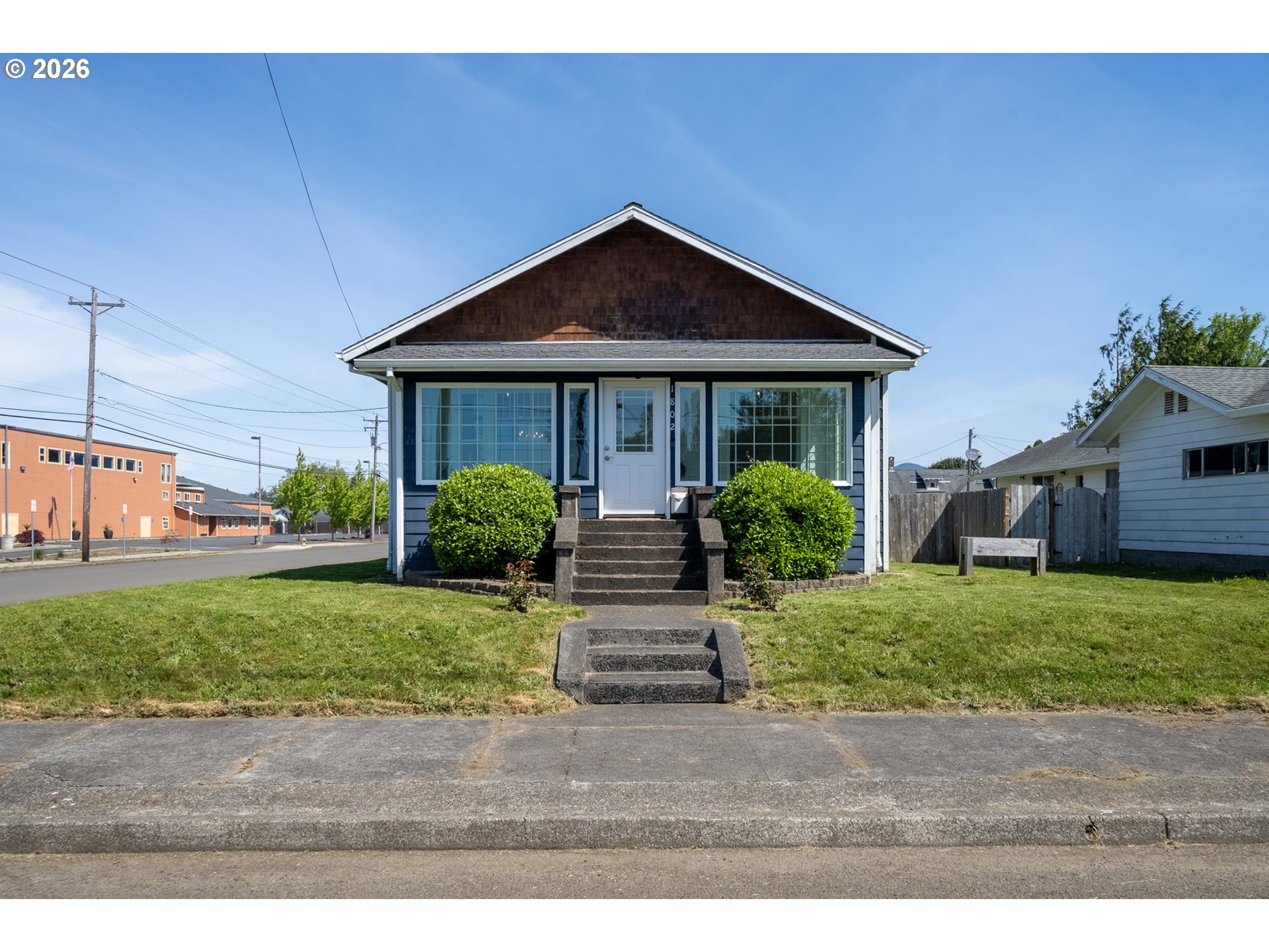1802 8th Street Tillamook, OR 97141 - Photo 2 of 37 a front view of house with yard and green space