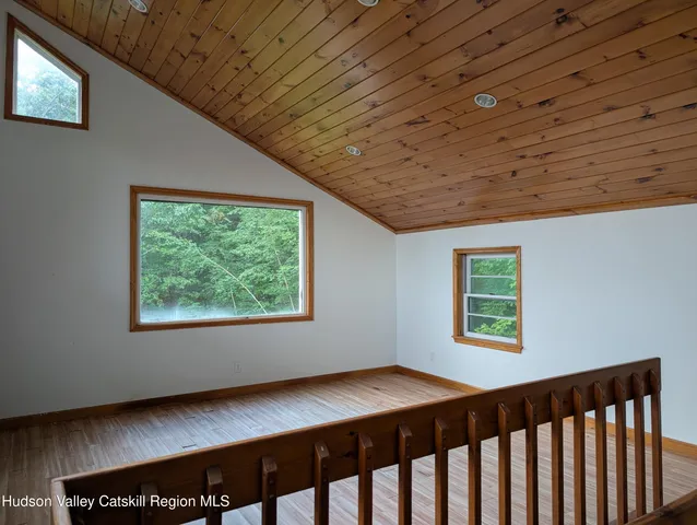 a view of a livingroom with a dishwasher and a window