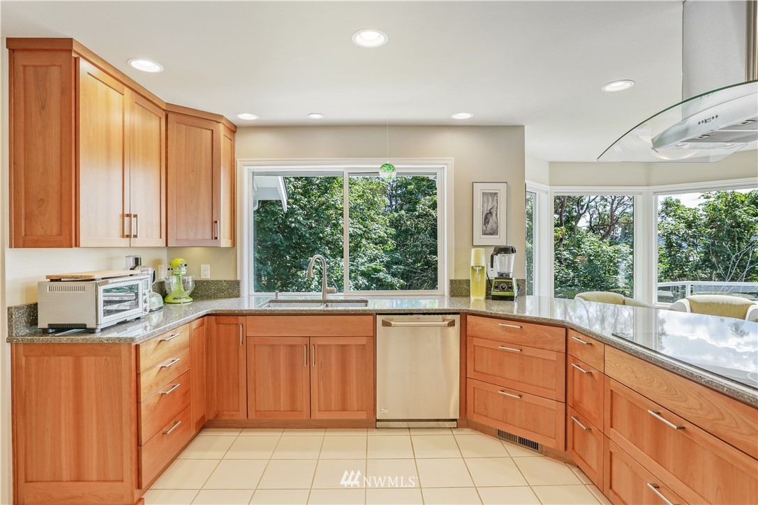 1325 North 24th Street Renton, WA 98056 - Photo 16 of 40 a kitchen with a sink window and cabinets
