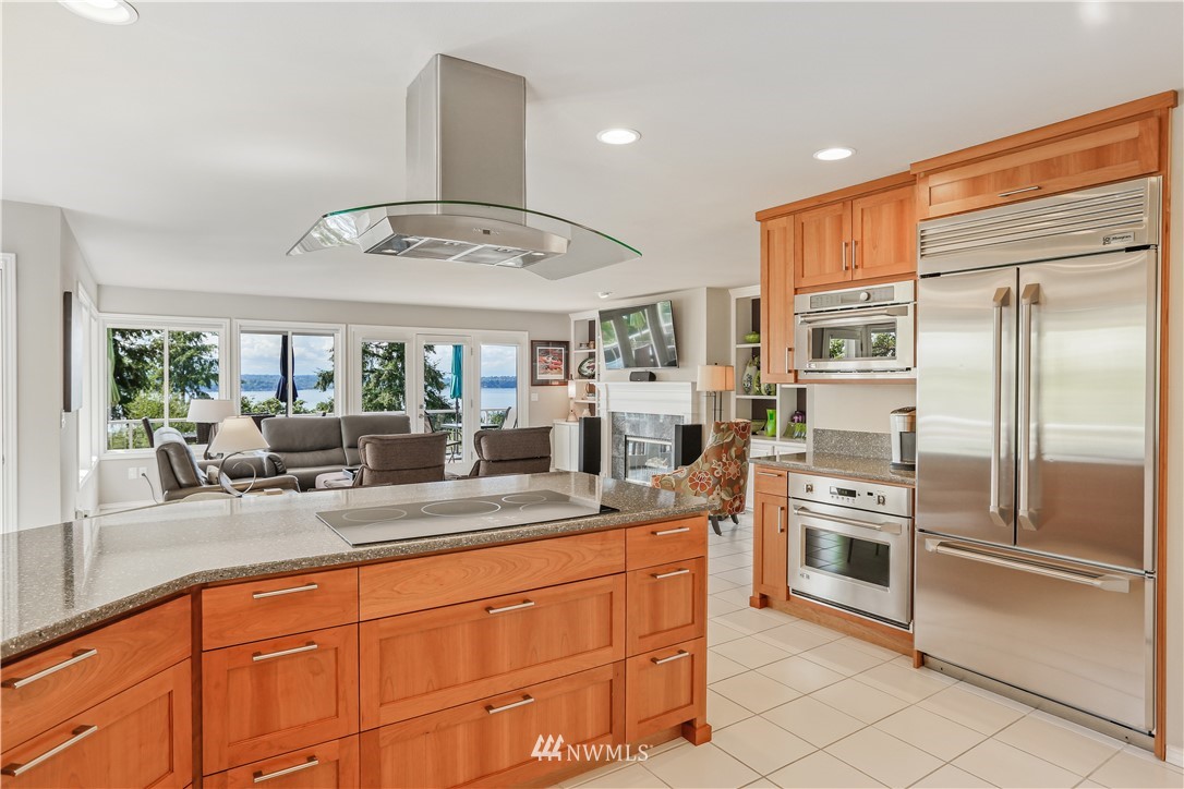 1325 North 24th Street Renton, WA 98056 - Photo 18 of 40 a kitchen with stainless steel appliances granite countertop a refrigerator and a sink