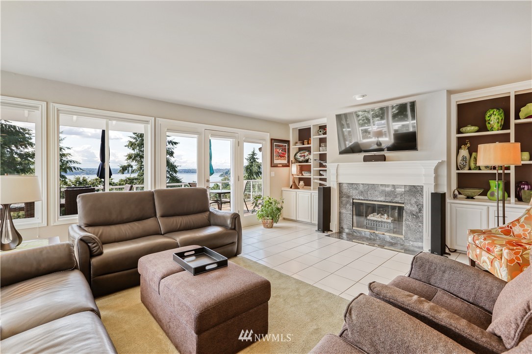 1325 North 24th Street Renton, WA 98056 - Photo 20 of 40 a living room with furniture a fireplace and a flat screen tv