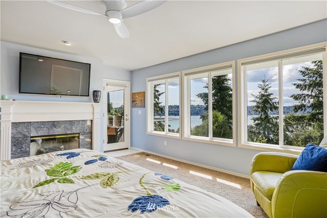 a spacious bedroom with a bed and a couch