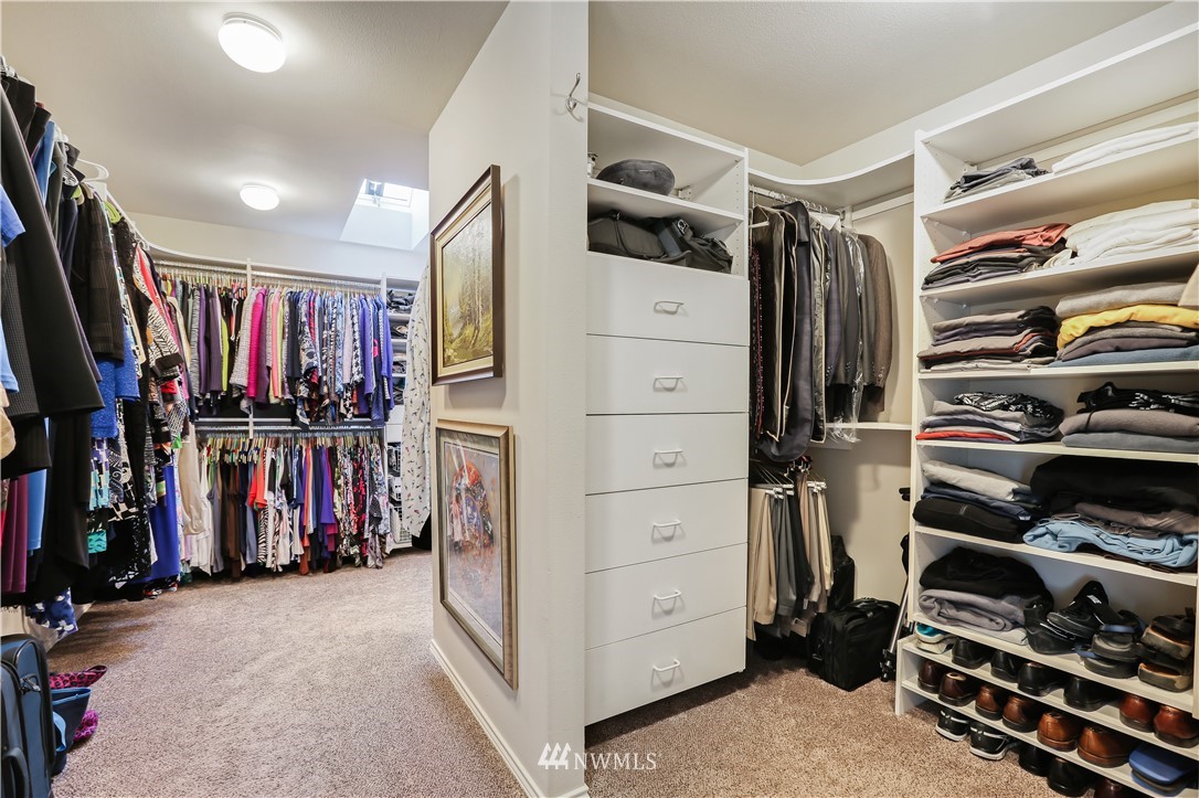 1325 North 24th Street Renton, WA 98056 - Photo 27 of 40 a view of walk in closet with clothes and shoes