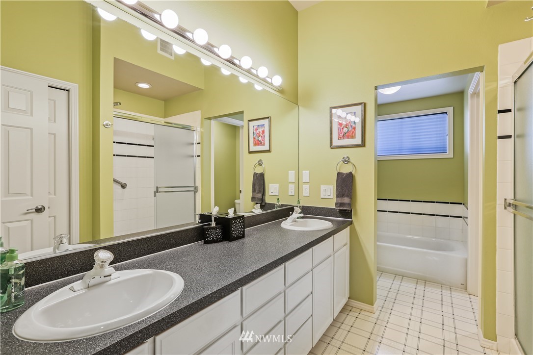 1325 North 24th Street Renton, WA 98056 - Photo 34 of 40 a bathroom with a granite countertop sink and a mirror