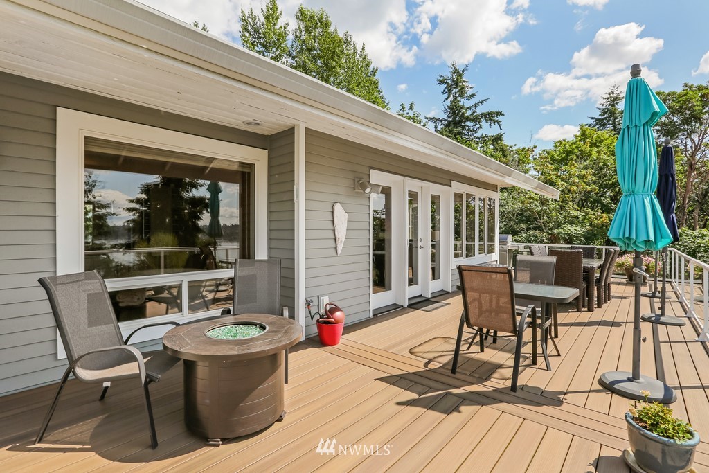 1325 North 24th Street Renton, WA 98056 - Photo 8 of 40 a view of a patio with table and chairs potted plants with wooden floor