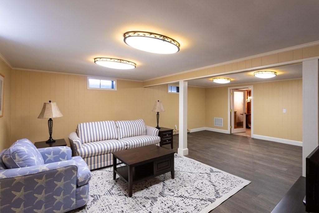 40 Bay Cotuit, MA 02635 - Photo 18 of 24 a living room with furniture and a rug
