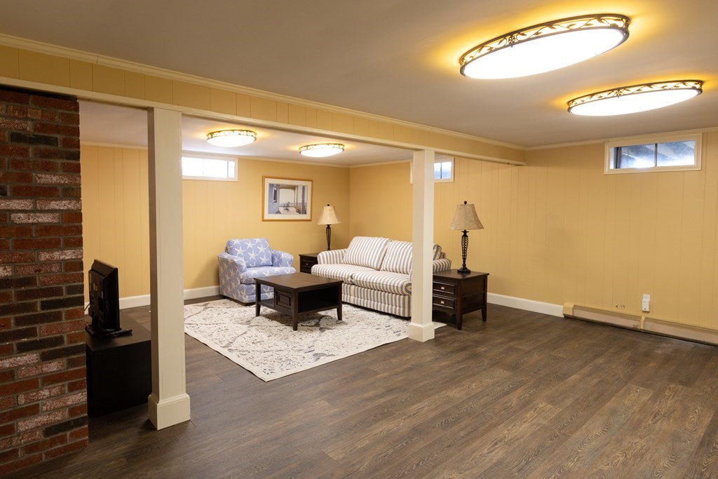 40 Bay Cotuit, MA 02635 - Photo 21 of 24 a living room with furniture and a wooden floor