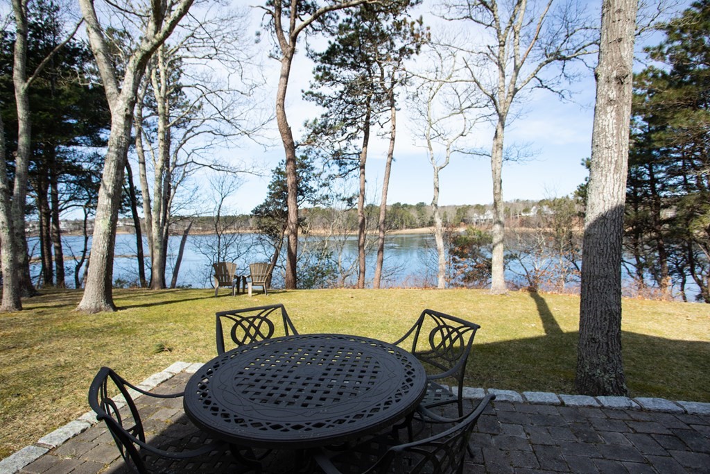 40 Bay Cotuit, MA 02635 - Photo 3 of 24 a view of a swimming pool with a lounge chairs
