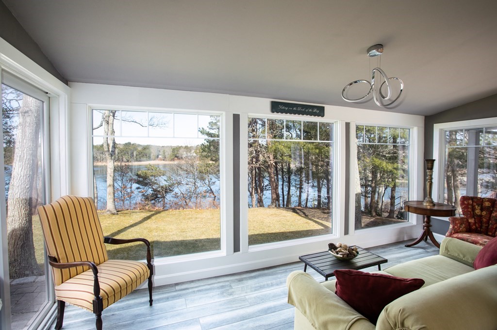 40 Bay Cotuit, MA 02635 - Photo 7 of 24 a living room with furniture and a floor to ceiling window