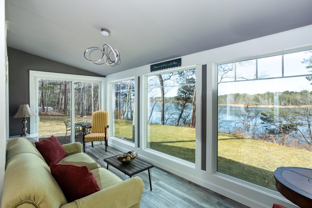 40 Bay Cotuit, MA 02635 - Photo 8 of 24 a living room with furniture and floor to ceiling windows