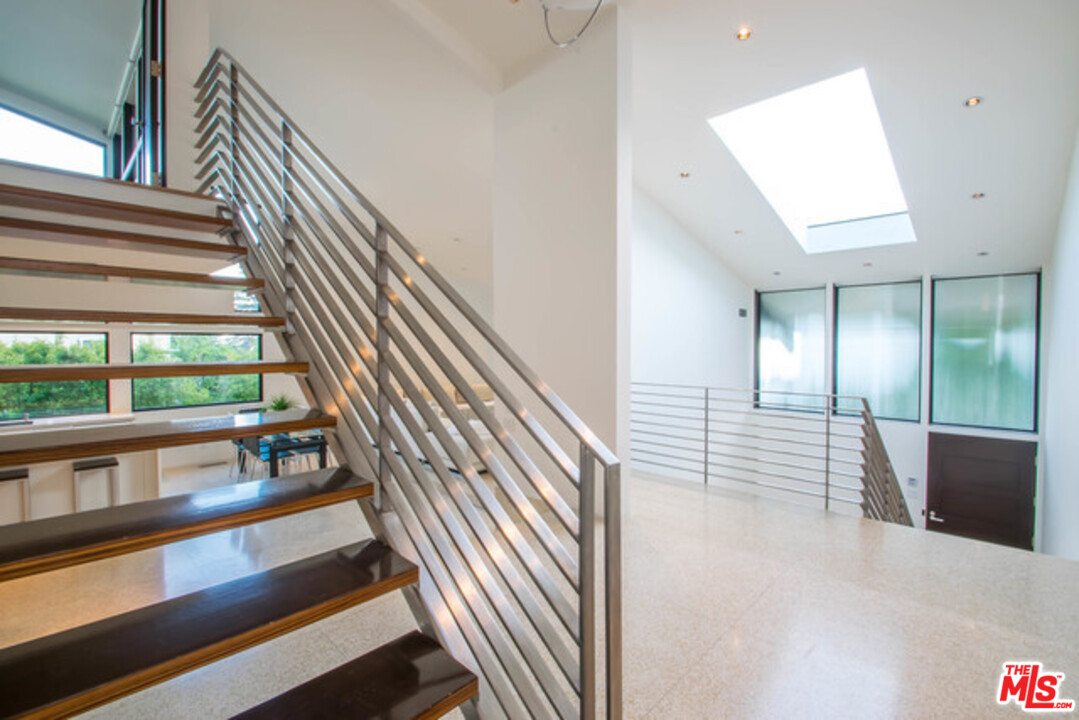 1440 North Kings Road Los Angeles, CA 90069 - Photo 12 of 37 a view of entryway and hall with wooden floor