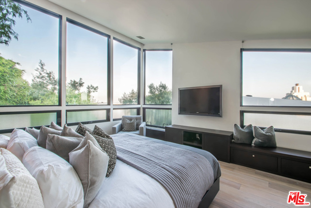 1440 North Kings Road Los Angeles, CA 90069 - Photo 13 of 37 a bedroom with bed and a flat screen tv