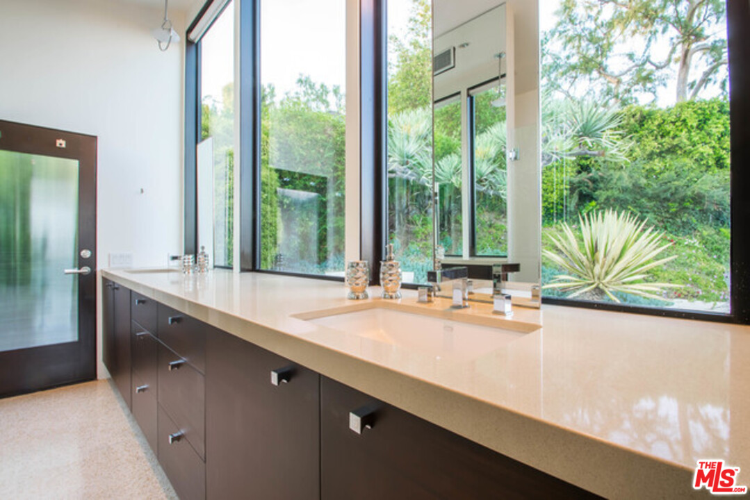 1440 North Kings Road Los Angeles, CA 90069 - Photo 18 of 37 a kitchen with sink and large window in it