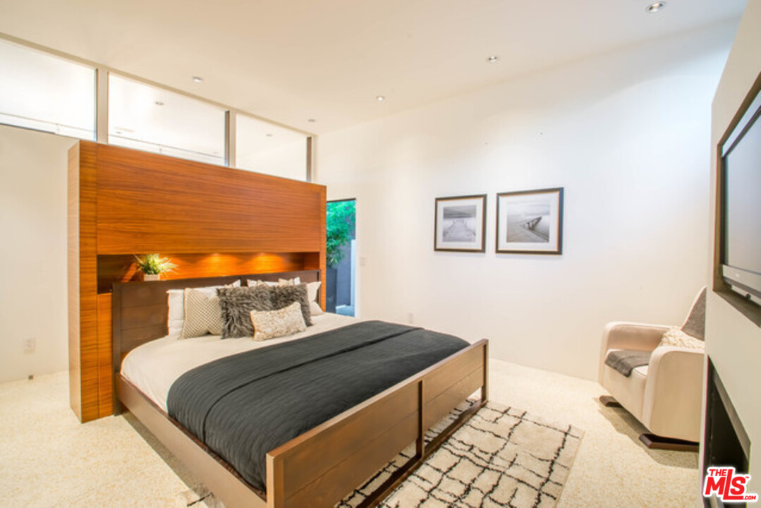 1440 North Kings Road Los Angeles, CA 90069 - Photo 20 of 37 a bedroom with a bed and window
