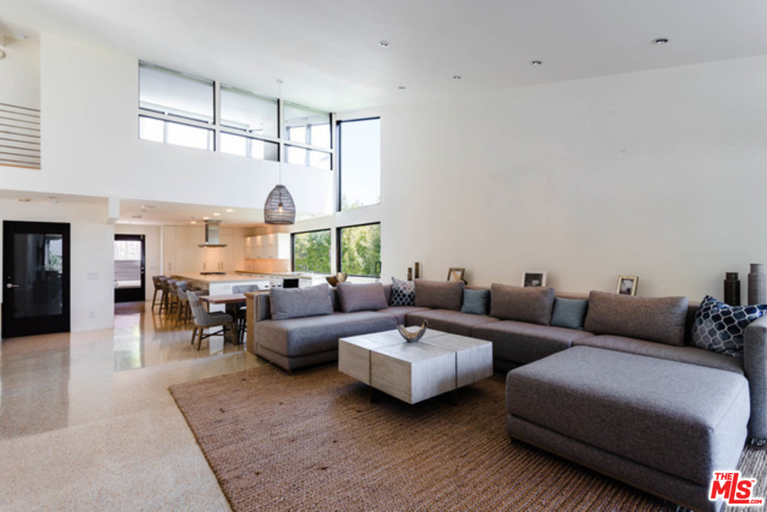 1440 North Kings Road Los Angeles, CA 90069 - Photo 4 of 37 a living room with furniture and a large window