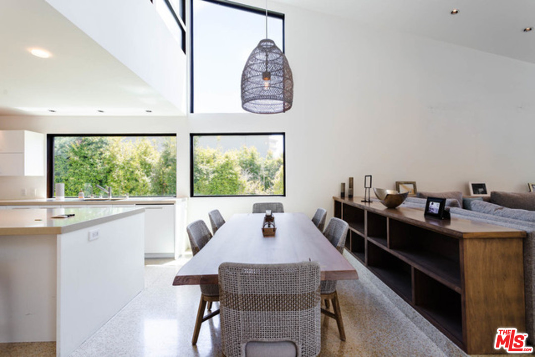 1440 North Kings Road Los Angeles, CA 90069 - Photo 7 of 37 a view of a dining room with furniture window and outside view