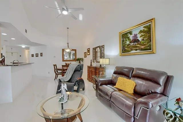 a view of a livingroom with workspace and a couch