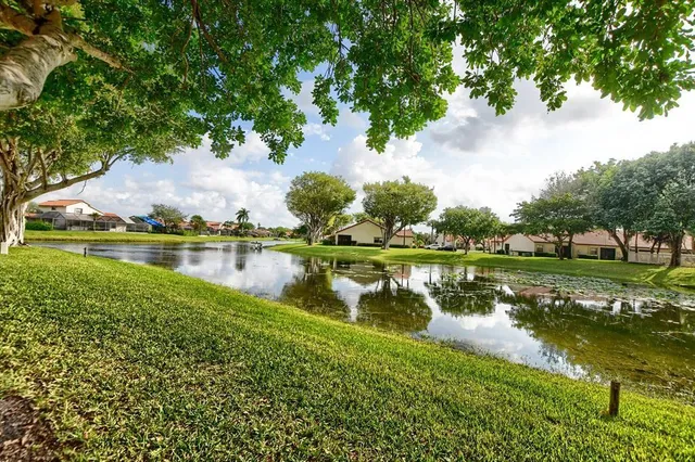 a view of lake with green space