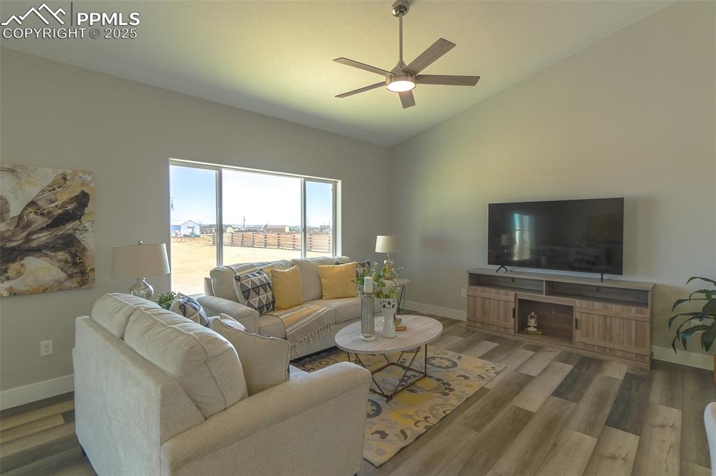 Lot 3 J D Johnson Road Peyton, CO 80831 - Photo 20 of 47 a living room with furniture and a flat screen tv